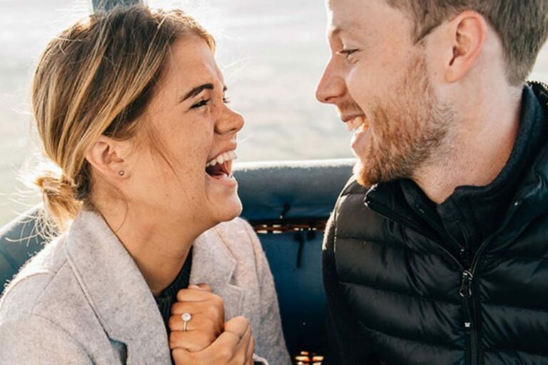 A couple laughing while taking a private balloon ride to Chester County and Philadelphia thanks to Lancaster Balloon Rides.