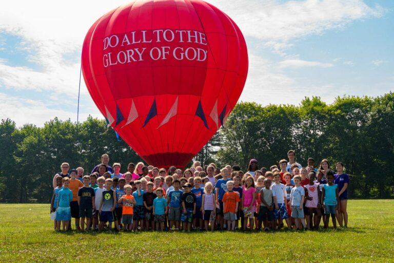 Children standing next to a mini Lancaster Balloon Rides hot air balloon while at the Valley Forge Baptist Day Camp