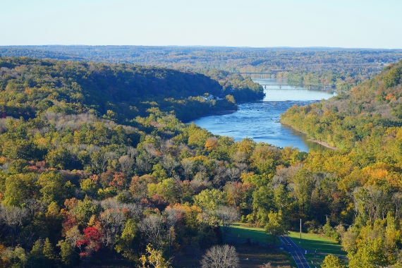 A vast view of a valley and river in Bucks County, PA seen during a Lancaster Balloon Rides hot air balloon ride.