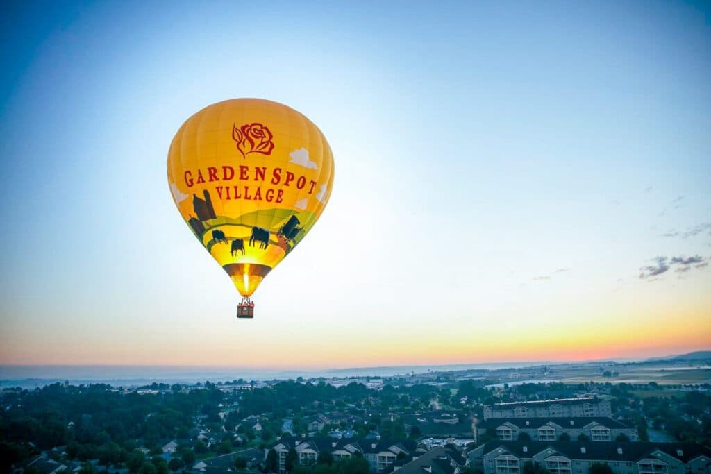 A hot air balloon overlooking a sunset in Lancaster, PA.