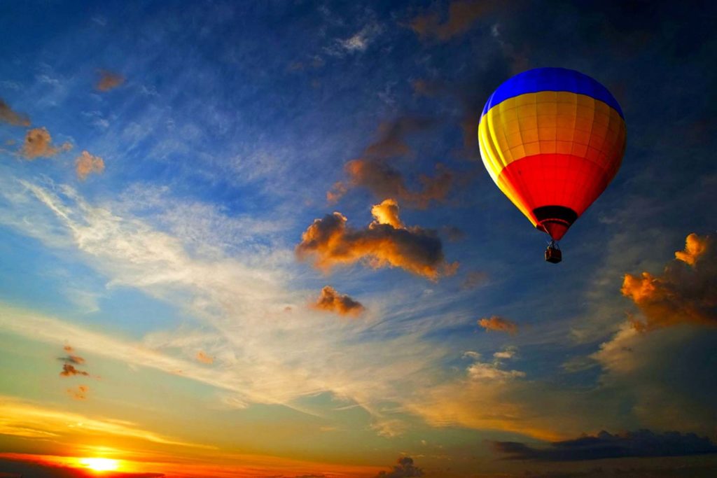 A Lancaster Balloon Rides hot air balloon taking a couple into the air to enjoy the Philadelphia sunset.